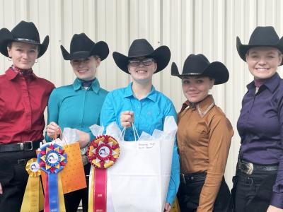 Members of the Alfred State western equestrian team display their awards from their season opening competition.