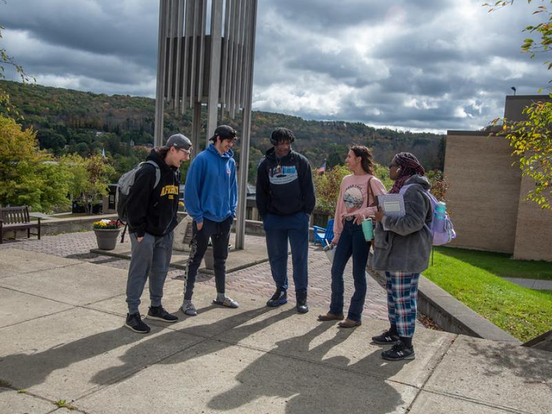 students in front of bell tower