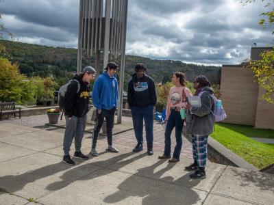 students in front of bell tower