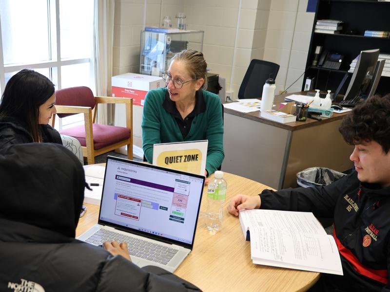 students work with a math tutor