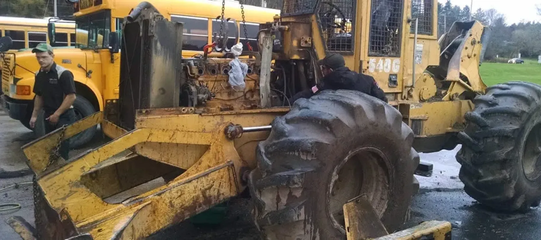 Student working on construction vehicle.