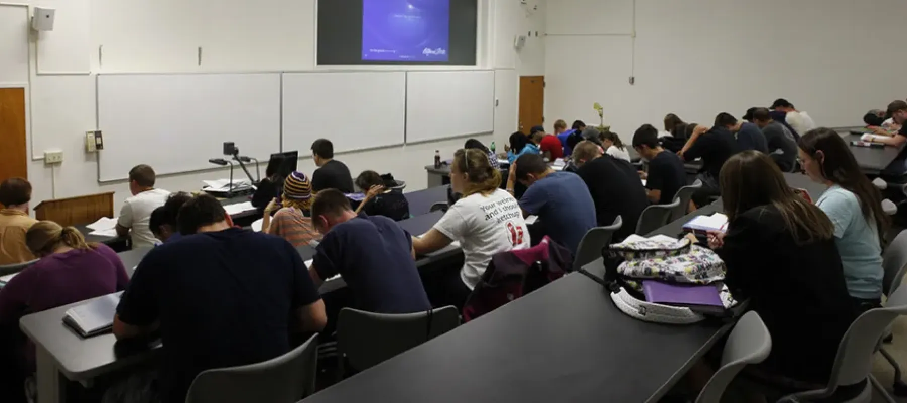 Students sitting inside classroom.