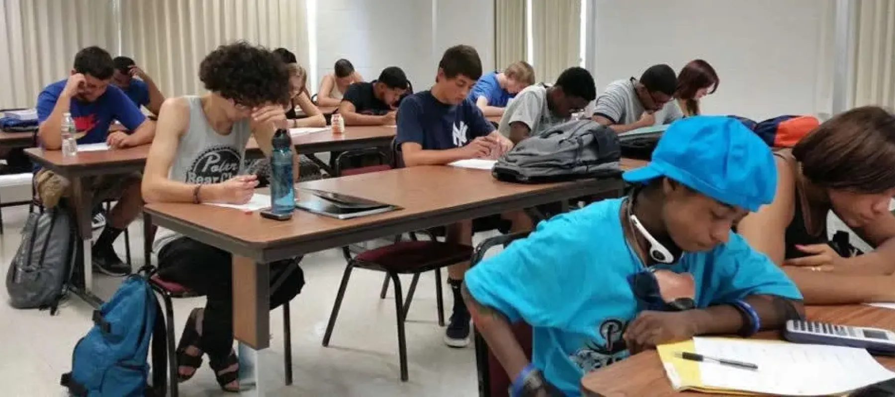 Students working on assignment in a classroom.