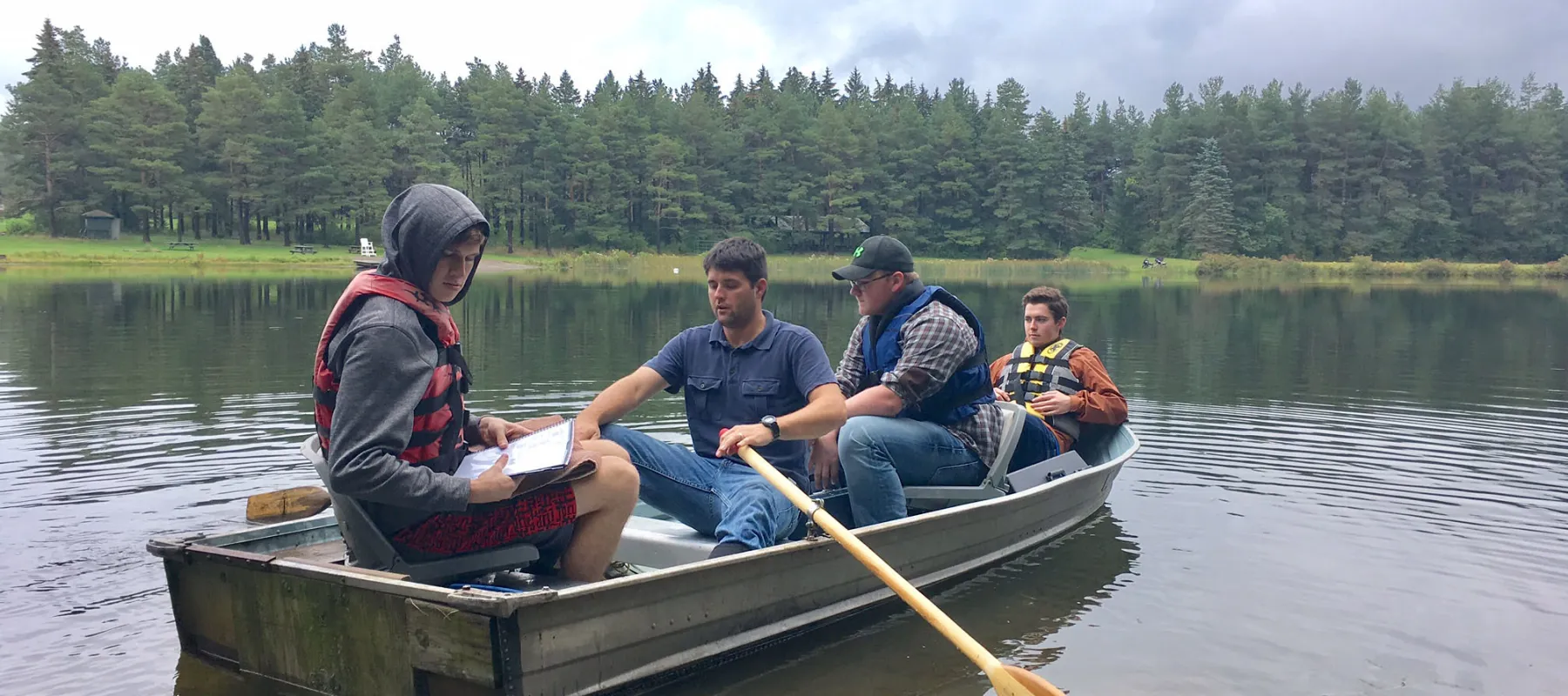 Pre-Environmental Science and Forestry students in a boat on a lake.