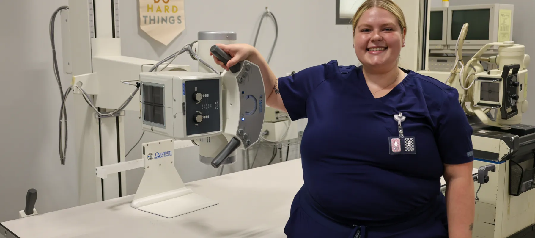 Radiologic Technology student posing with equipment.