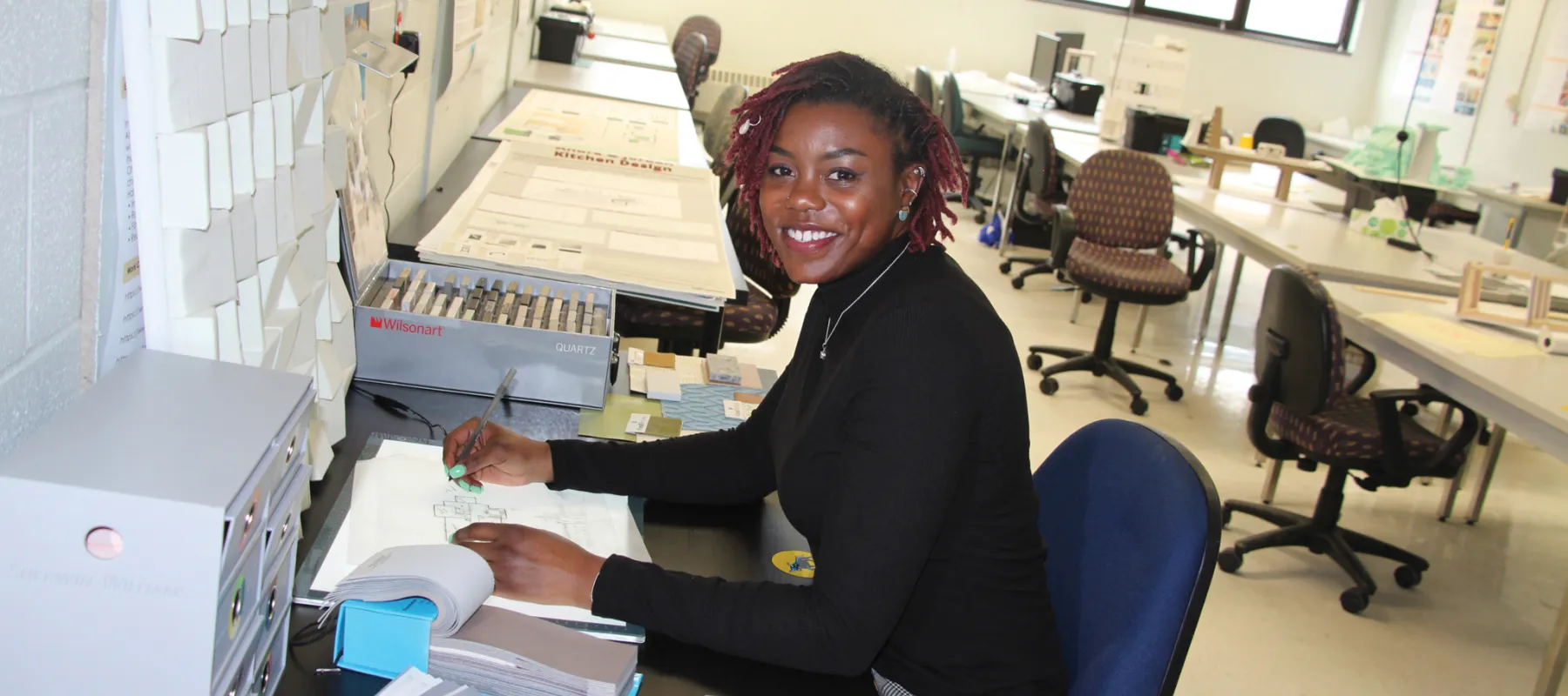Interior design student working in the classroom.