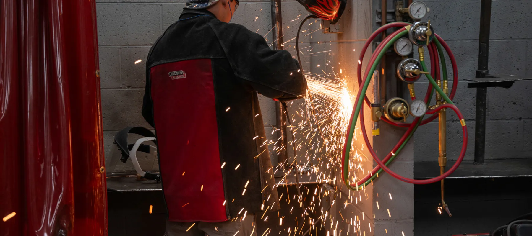 Welding technology student working in the lab on campus.