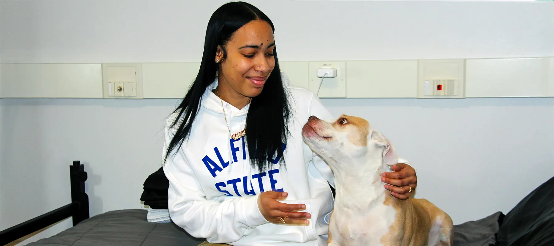 ASC student with her dog on campus.