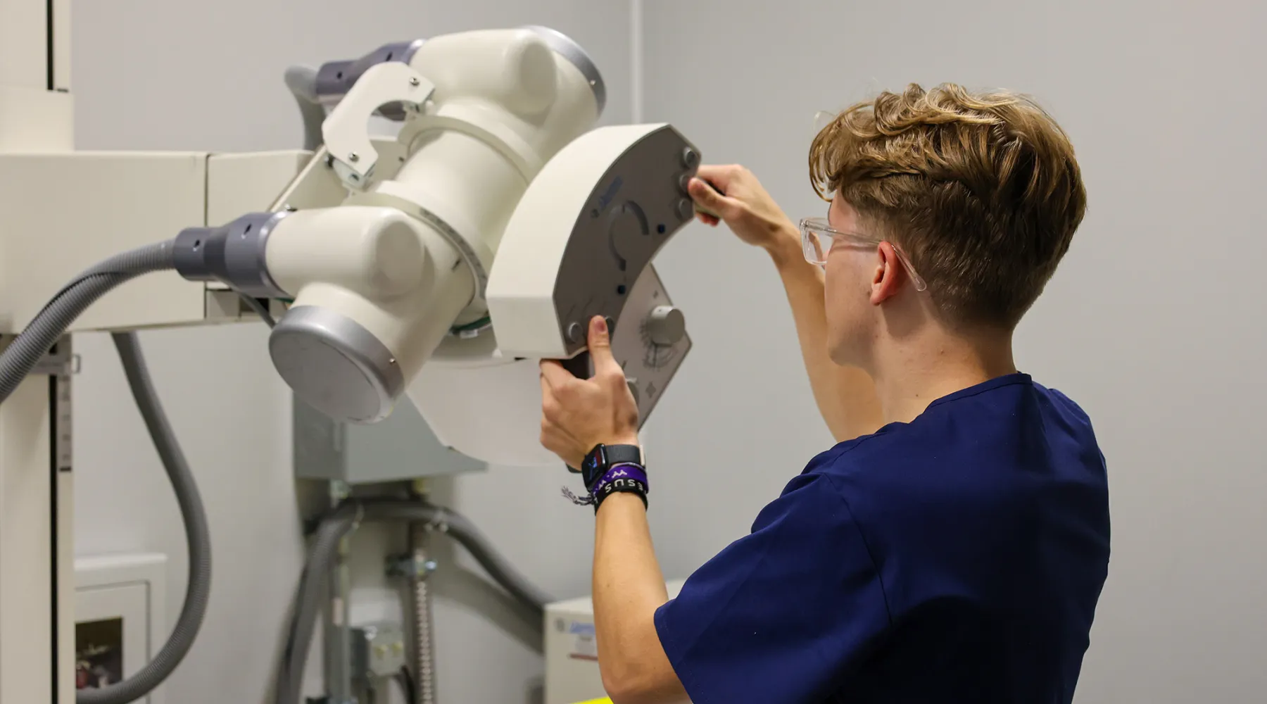 A student working on a sonography machine.