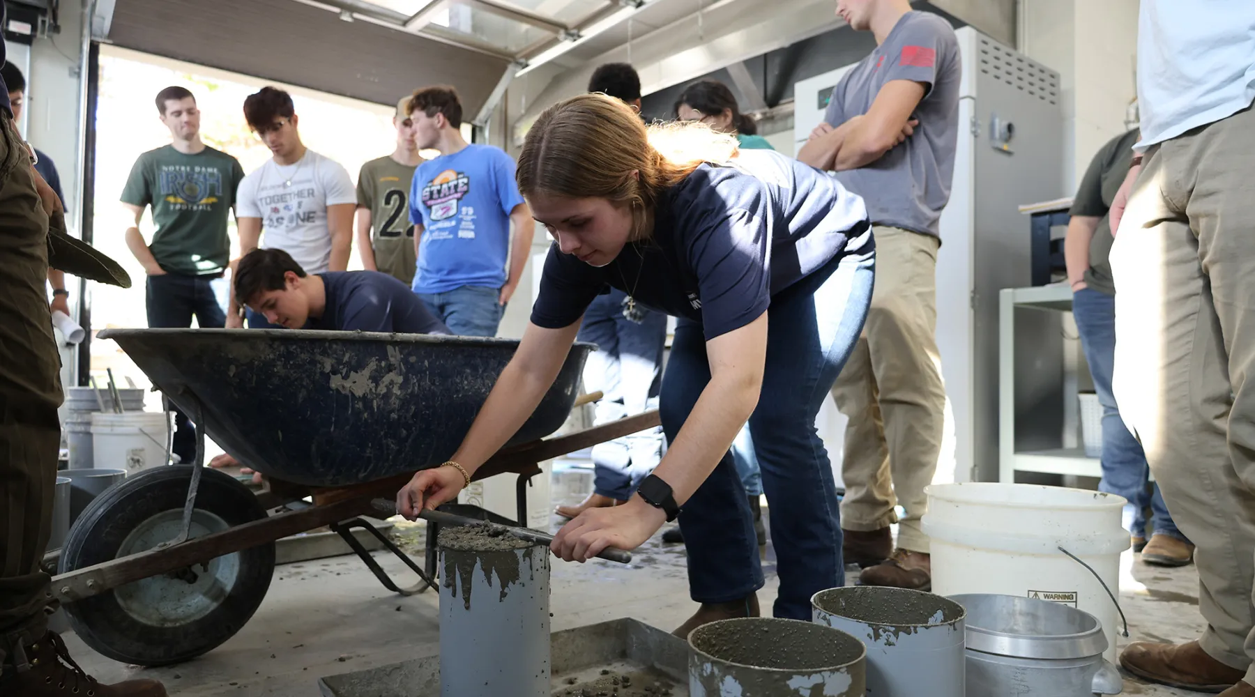 A student testing concrete mixtures.