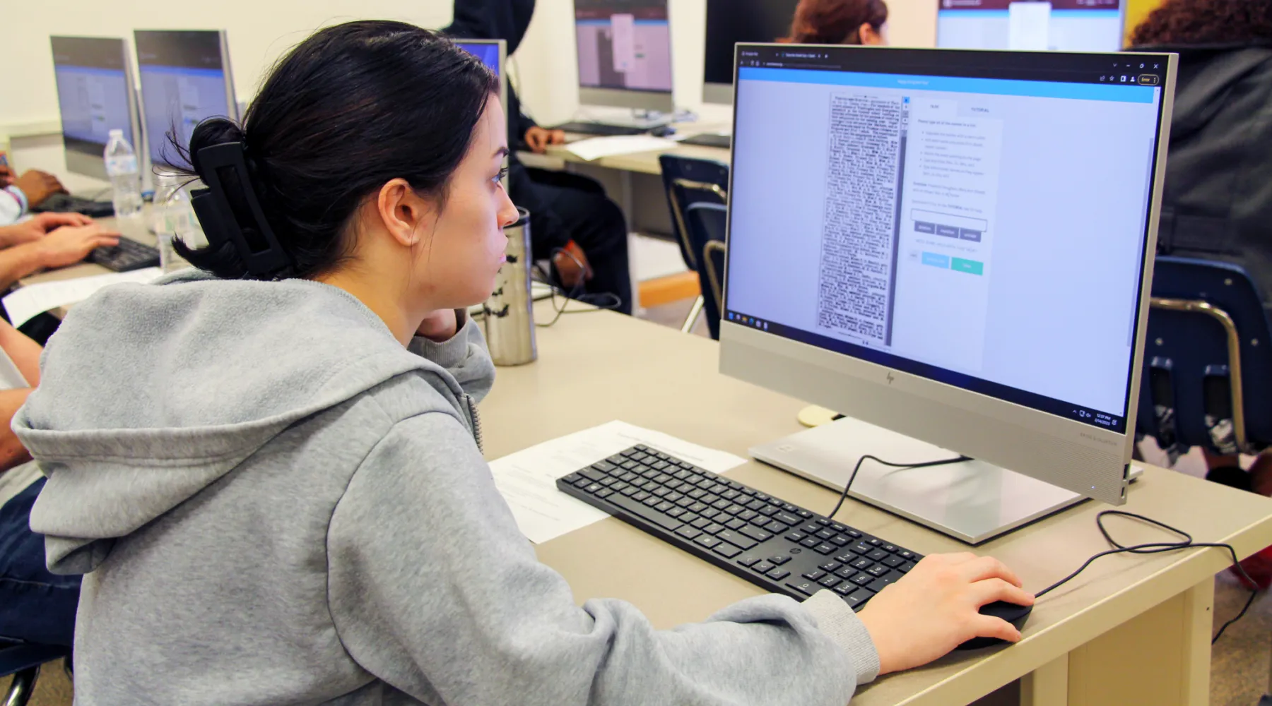 A student coding on a computer