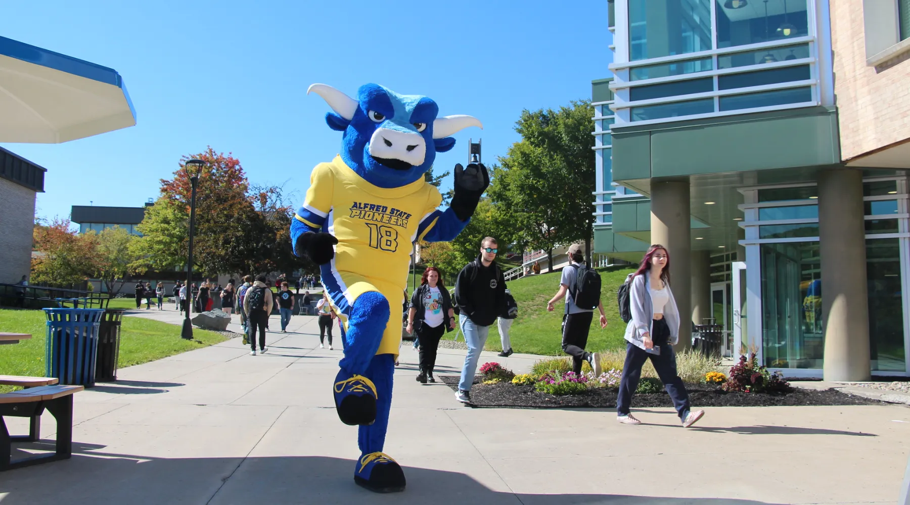 Alfred State Mascot, Big Blue, posing on campus