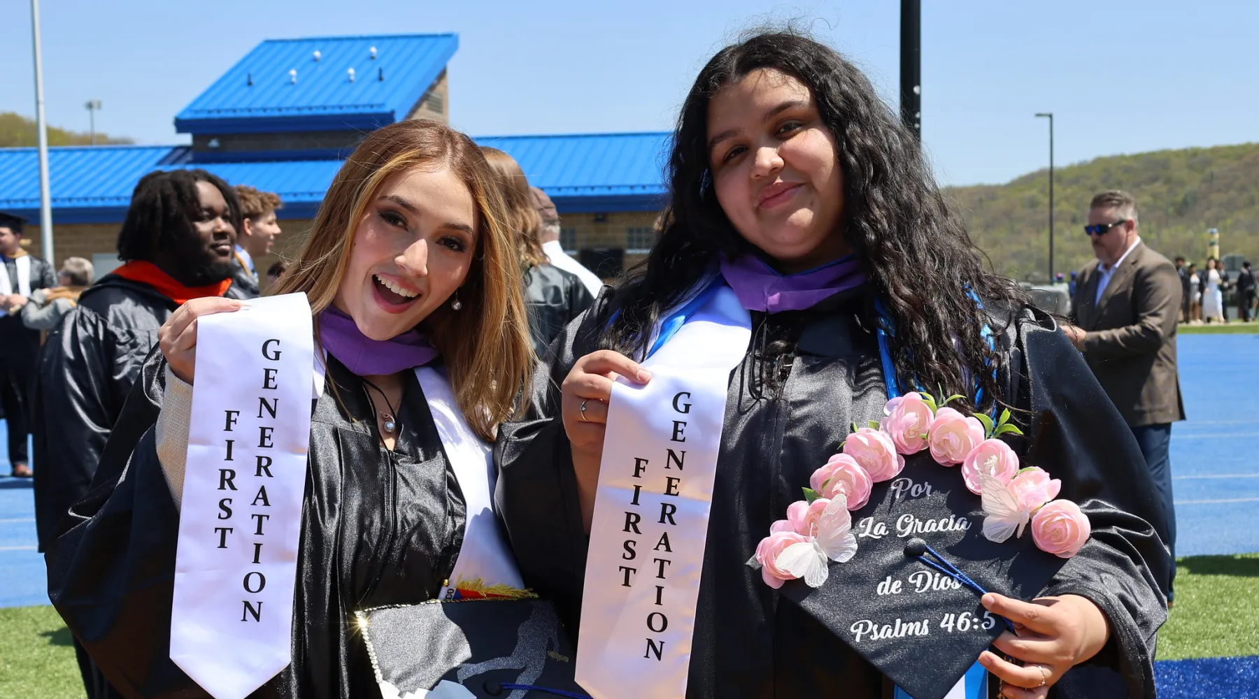 Two students in graduation caps and gowns