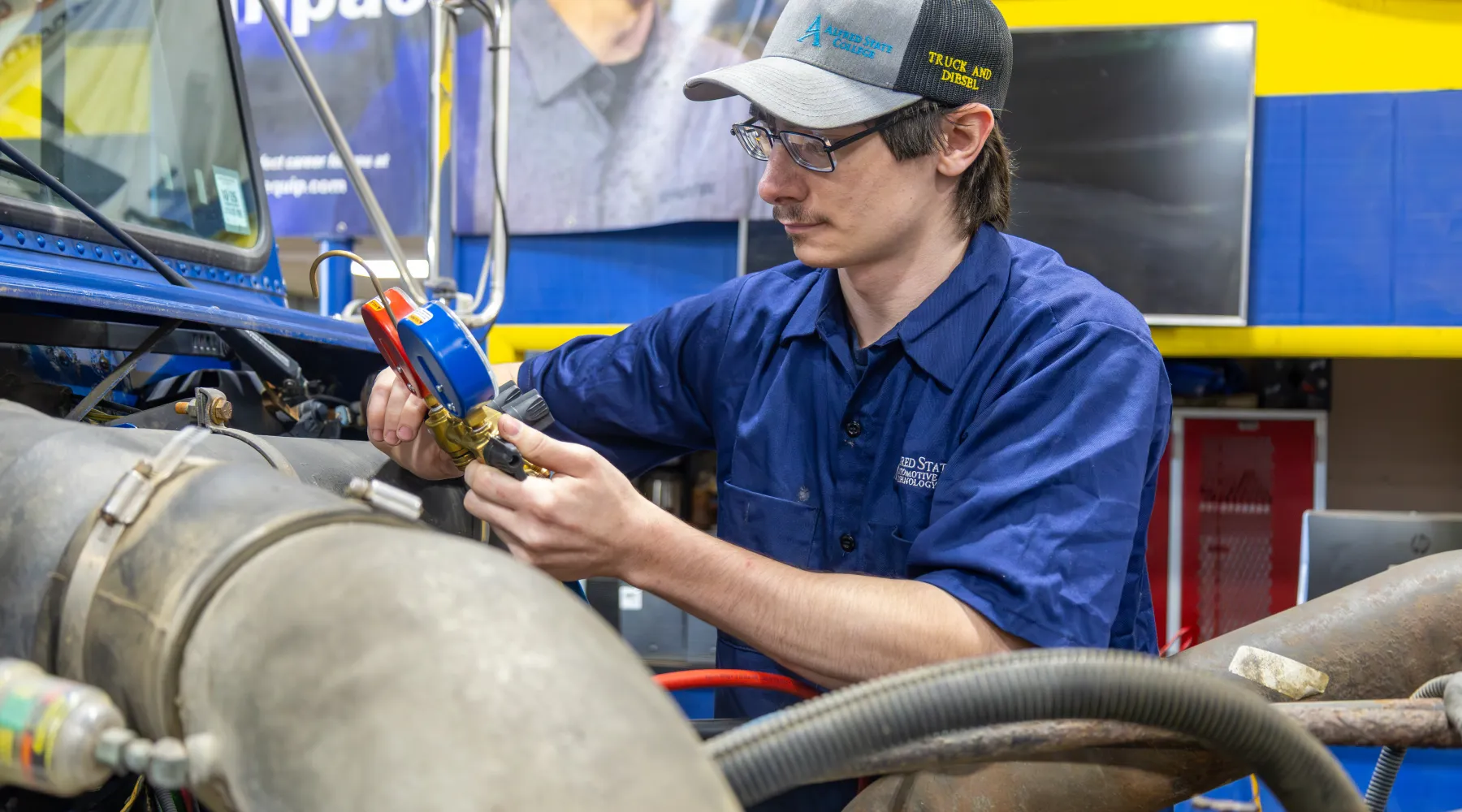 A student working on a heavy-duty truck.